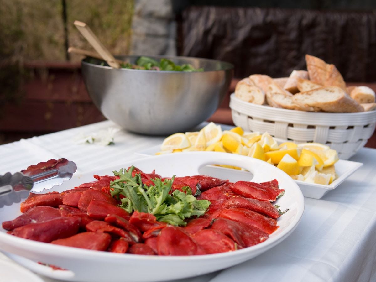 Stuffed Spanish piquillo peppers on a ceramic plate. Stuffed Spanish piquillo peppers on a ceramic plate.
