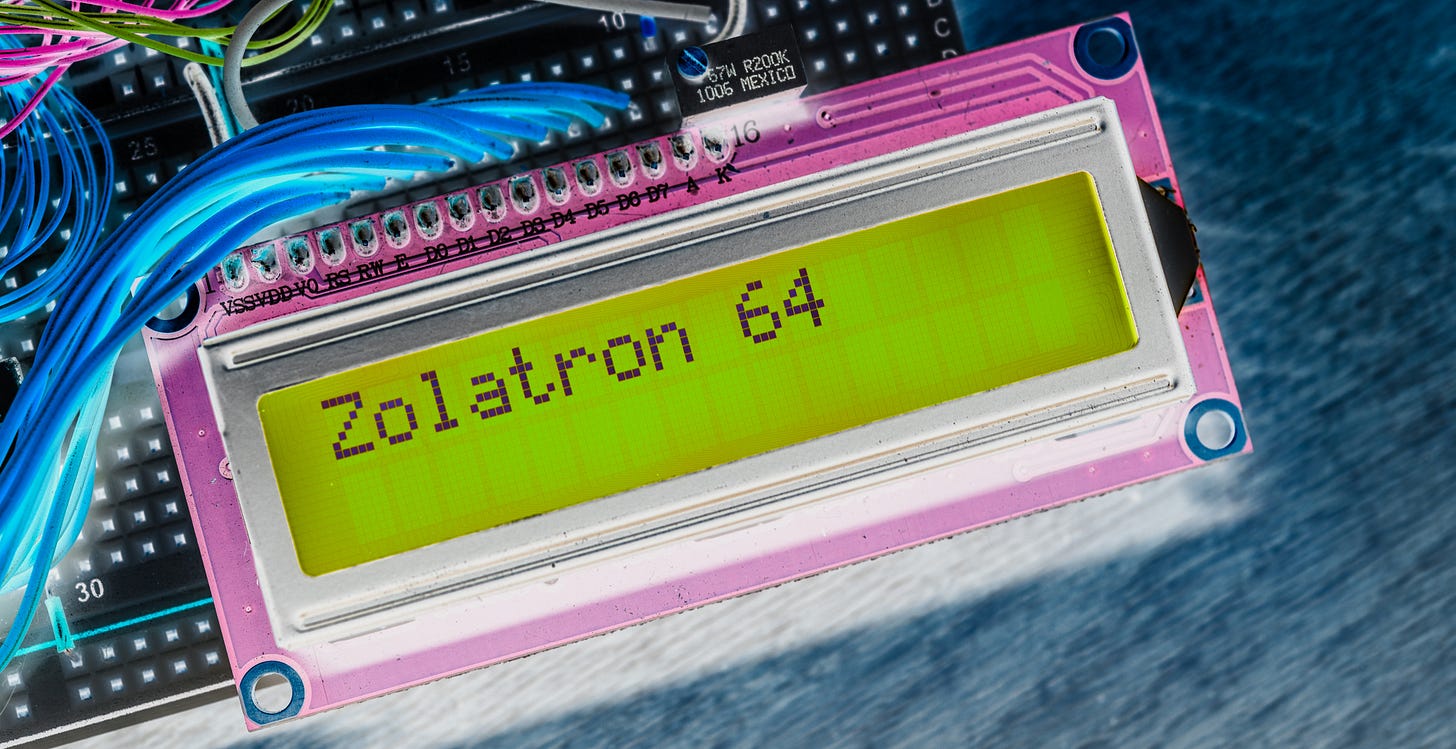 Manipulated photograph of an LCD panel displaying the text: Zolatron 64.