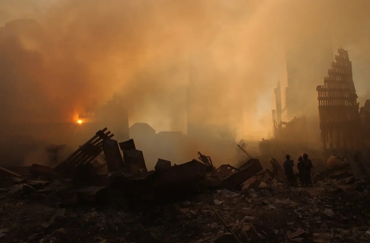 Image: 9/11 - The sun streams through the dust cloud over the wreckage of the World Trade Center Image: 9/11 - The sun streams through the dust cloud over the wreckage of the World Trade Center