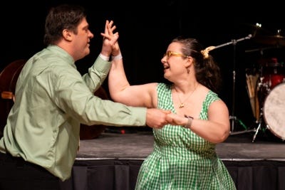 Dancers smiling at each other