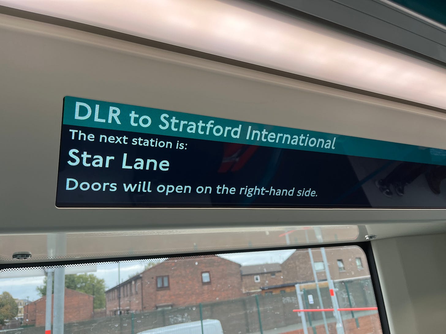 Photo of a passenger information screen showing next station as Star Lane.