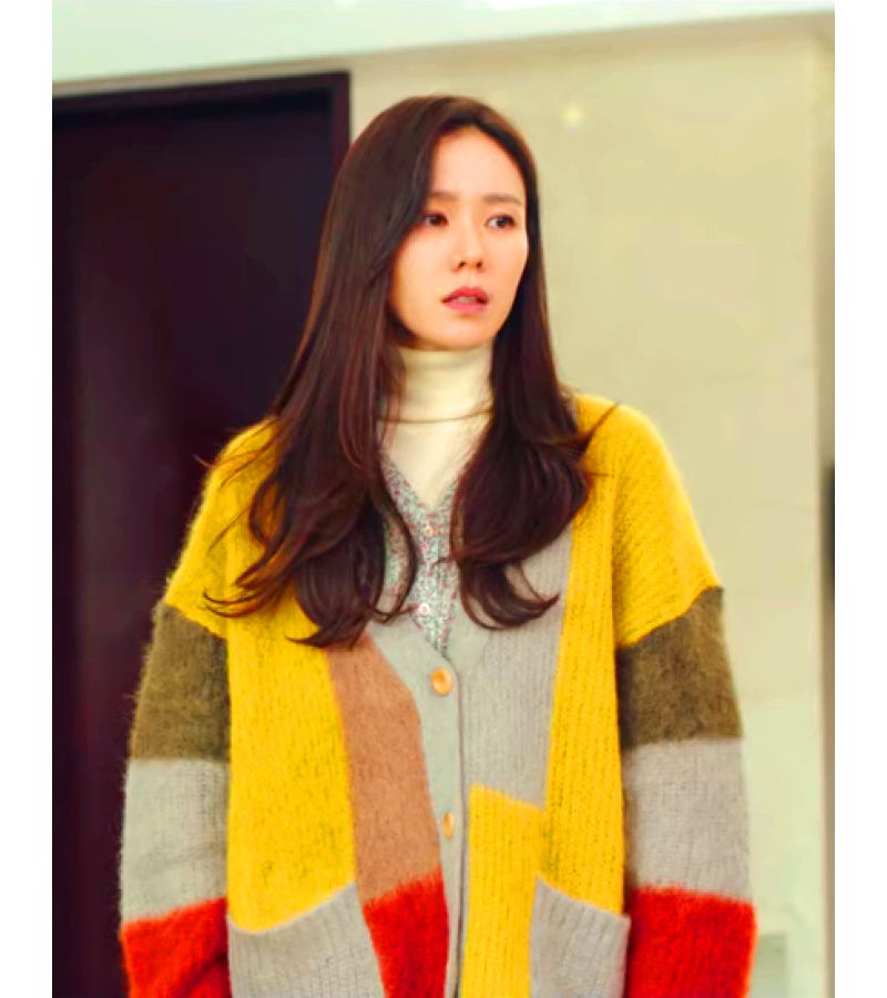 Seri from Crash Landing on You, a pretty Korean woman, wears an oversized multicoloured cardigan with autumn shaded patches Seri from Crash Landing on You, a pretty Korean woman, wears an oversized multicoloured cardigan with autumn shaded patches