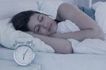 Beautiful brunette sleeping in her bed at home in the bedroom Beautiful brunette sleeping in her bed at home in the bedroom