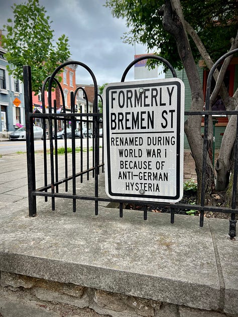 Mural on Rosie's Social Club, Glockenspeil at Goebel Park, Goose Girl Fountain, Street sign reflecting WWII anti-German changes, statuary detail at Mother of God church, Mural of Mainstrasse, Cathedral Basilica, Strasse Haus