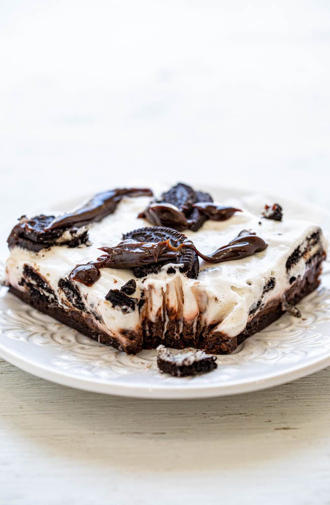 Mississippi Mud Pie Bars - An EASY, almost no-bake dessert with a chocolate chip cookie base, chocolate pudding, sweetened cream cheese, Oreos, and hot fudge!! RICH, decadent, indulgent, and a great party dessert that you can MAKE-AHEAD!! Mississippi Mud Pie Bars - An EASY, almost no-bake dessert with a chocolate chip cookie base, chocolate pudding, sweetened cream cheese, Oreos, and hot fudge!! RICH, decadent, indulgent, and a great party dessert that you can MAKE-AHEAD!!
