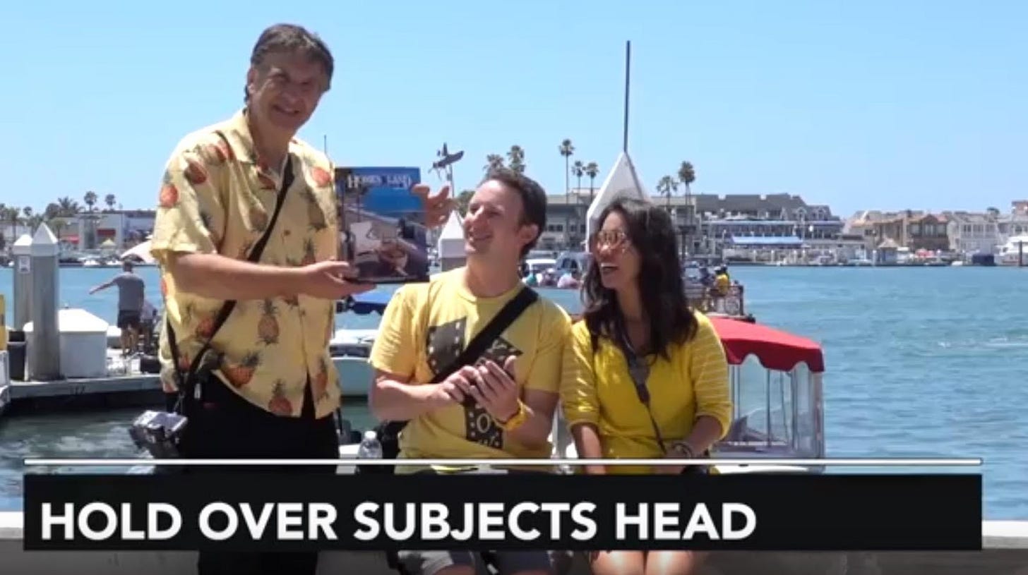 A group of people standing in front of a boat

Description automatically generated
