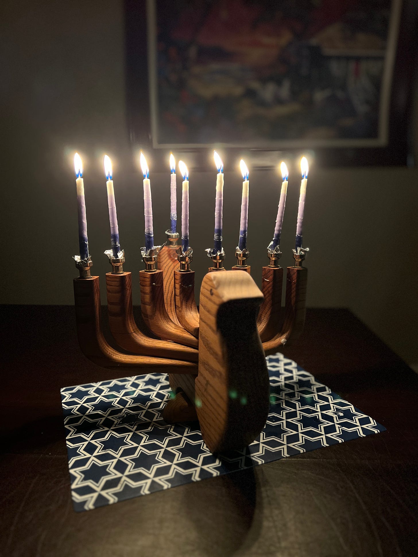 Hanukkiah with all 8 candles lit.