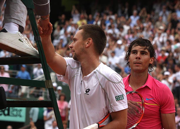 Robin Soderling of Sweden, shakes hads with the umpire after defeating Rafael Nadal of Spain, in the fourth round of the French Open at Roland...