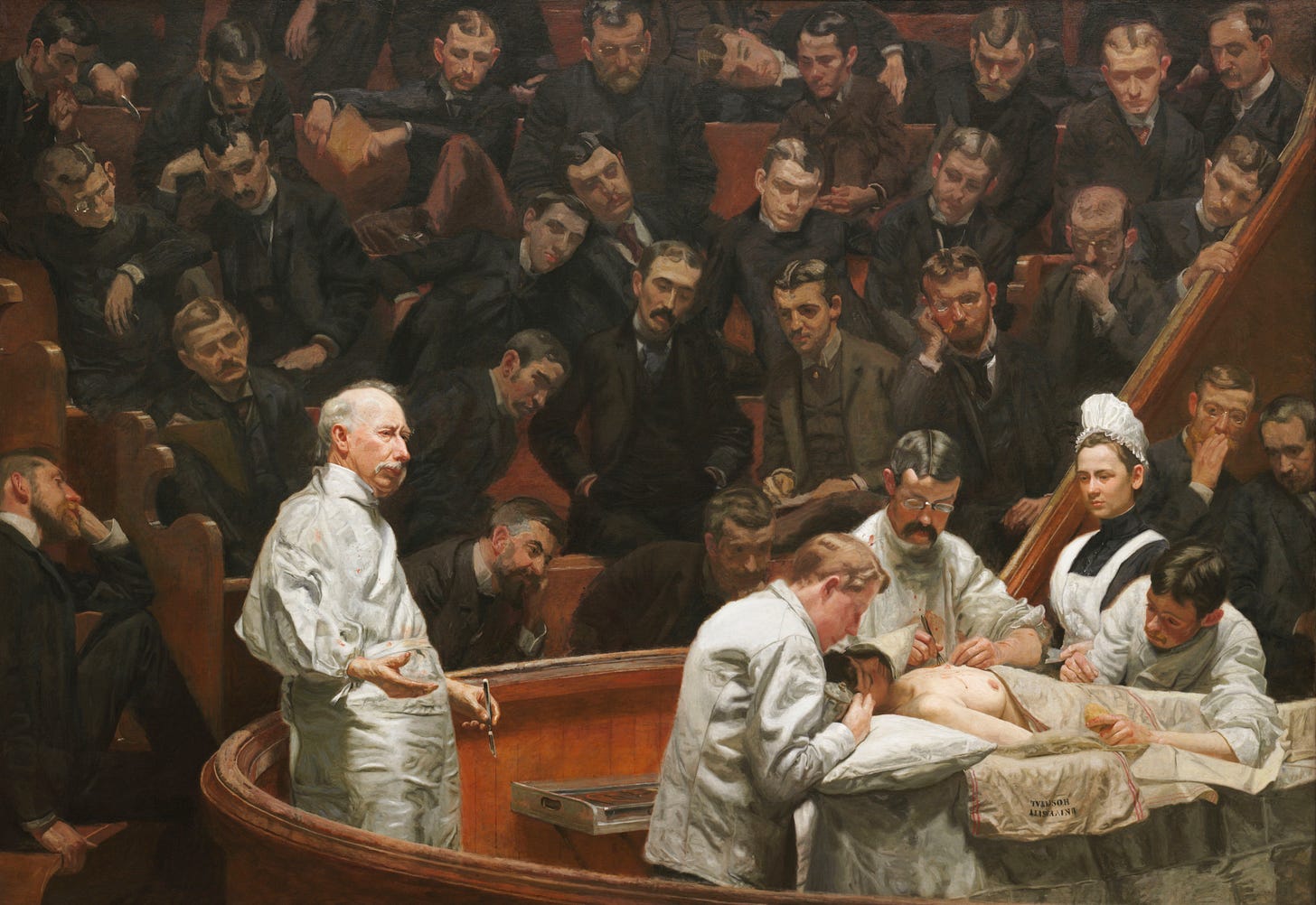 Thomas Eakins, The Agnew Clinic: Dr Agnew addressing students in a white coat beside the operating table Thomas Eakins, The Agnew Clinic: Dr Agnew addressing students in a white coat beside the operating table