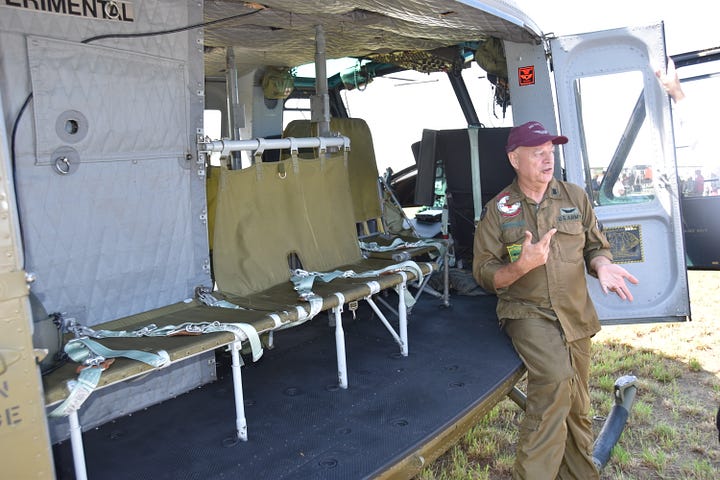Scenes from American Huey 369 Patriot Day with pilots and volunteers.