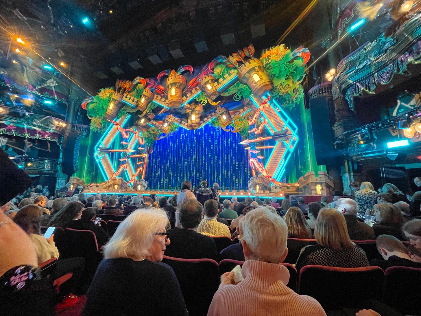 A view of an elaborate brightly lit stage at the London Palladium