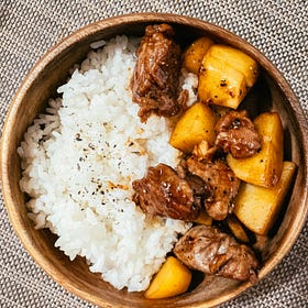 Korean-style spare ribs served with rice and grilled pineapple