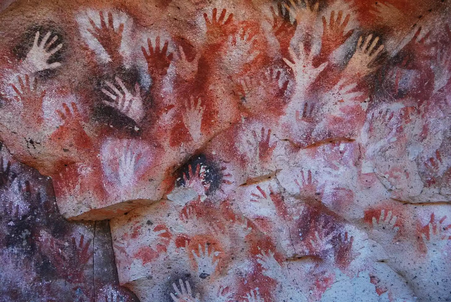 Full frame shot of handprints on the cave wall at Cueva De Las Manos. Full frame shot of handprints on the cave wall at Cueva De Las Manos.