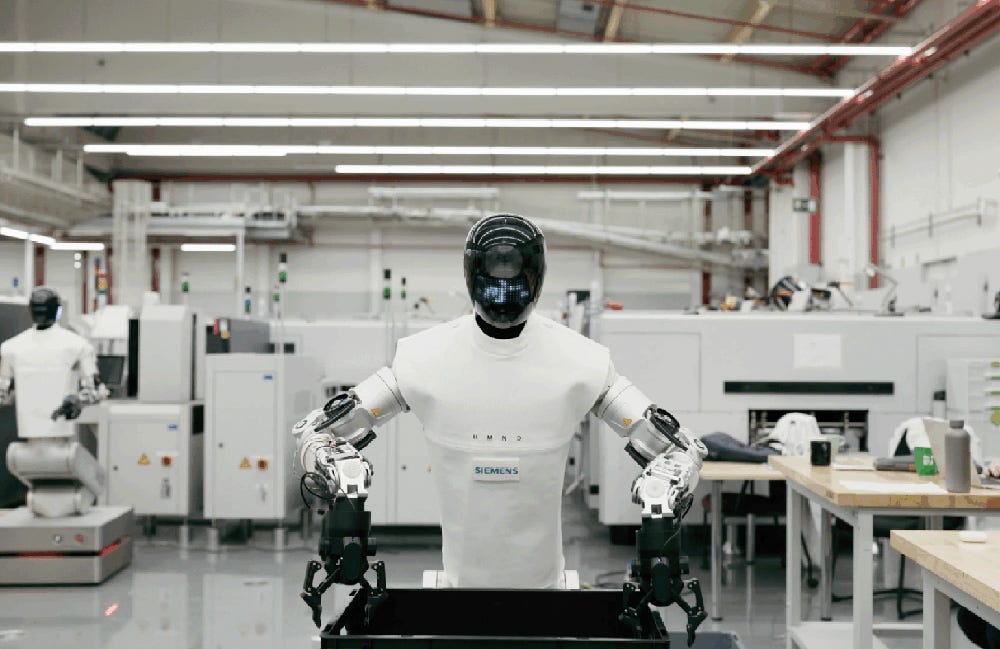 A mobile manipulator from Humanoid picking up a tote from a conveyor at Siemens.
