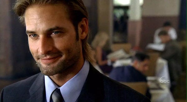 Big ol' John "Sawyer" Ford (Josh Holloway) dressed all fancy in a suit, wearin' a big ol' shit-eatin' grin, darlin'.