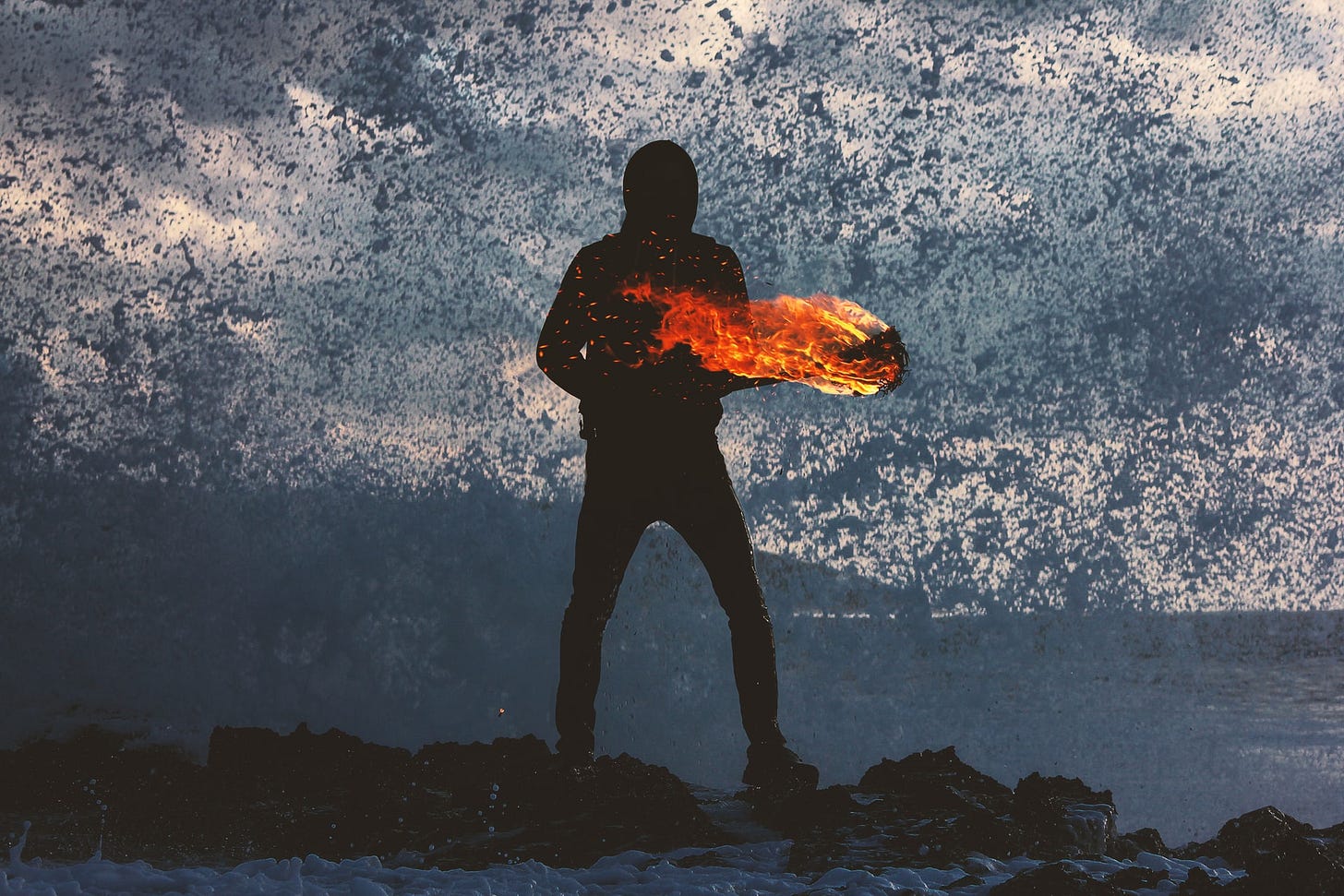 Silouhette of a man holding a burning log in a cloud of ash Silouhette of a man holding a burning log in a cloud of ash