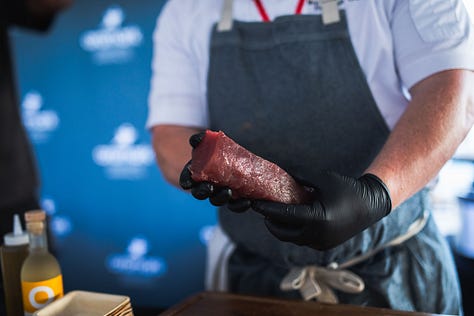 “Chefs from Aramark Collegiate Hospitality showcasing coastal-inspired dishes at the NC Seafood Festival 2025 — including seafood risotto, crab gumbo, and fried shrimp tacos — during live cooking demos and tastings with festival guests.”