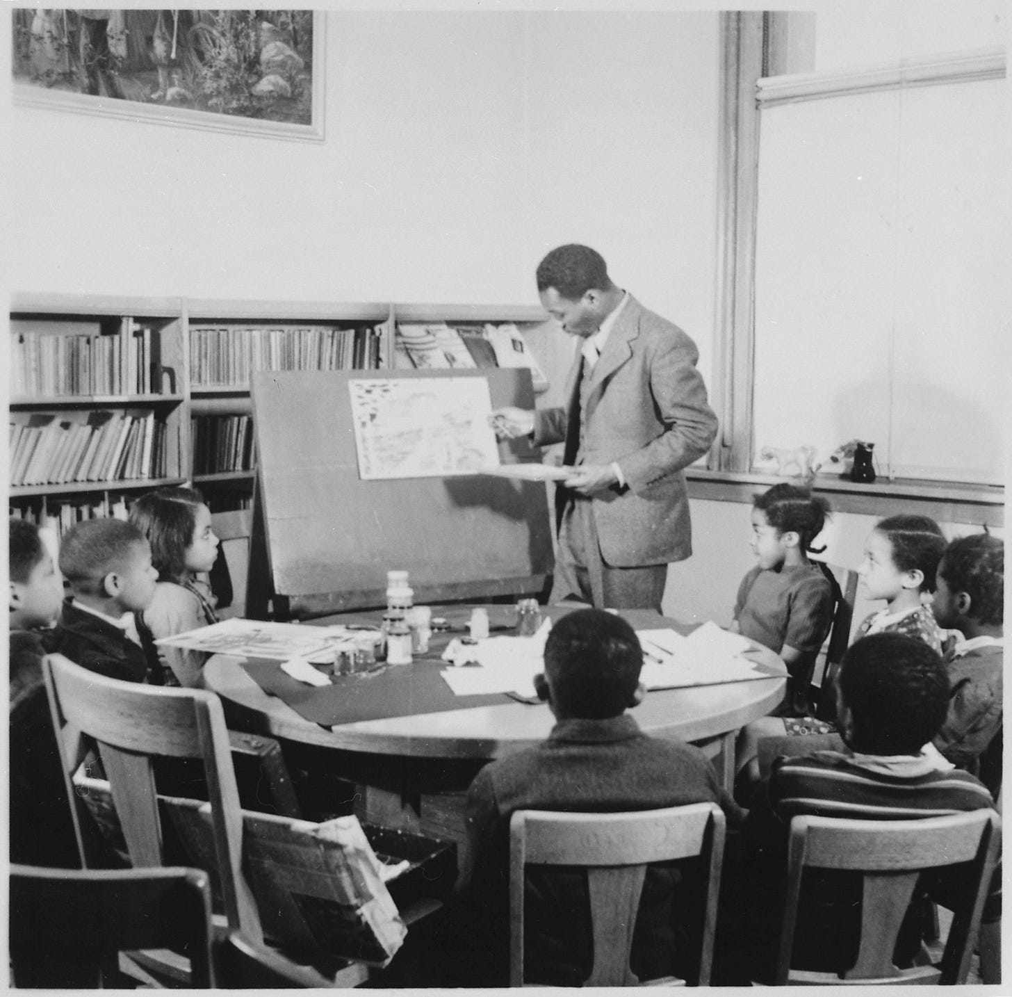 Jacob Lawrence teaching a painting demonstration to children at Lincoln School. Jacob Lawrence teaching a painting demonstration to children at Lincoln School.