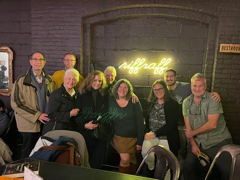 A photo of the author holding her book, a photo of the author with family, a photo of an orange aura