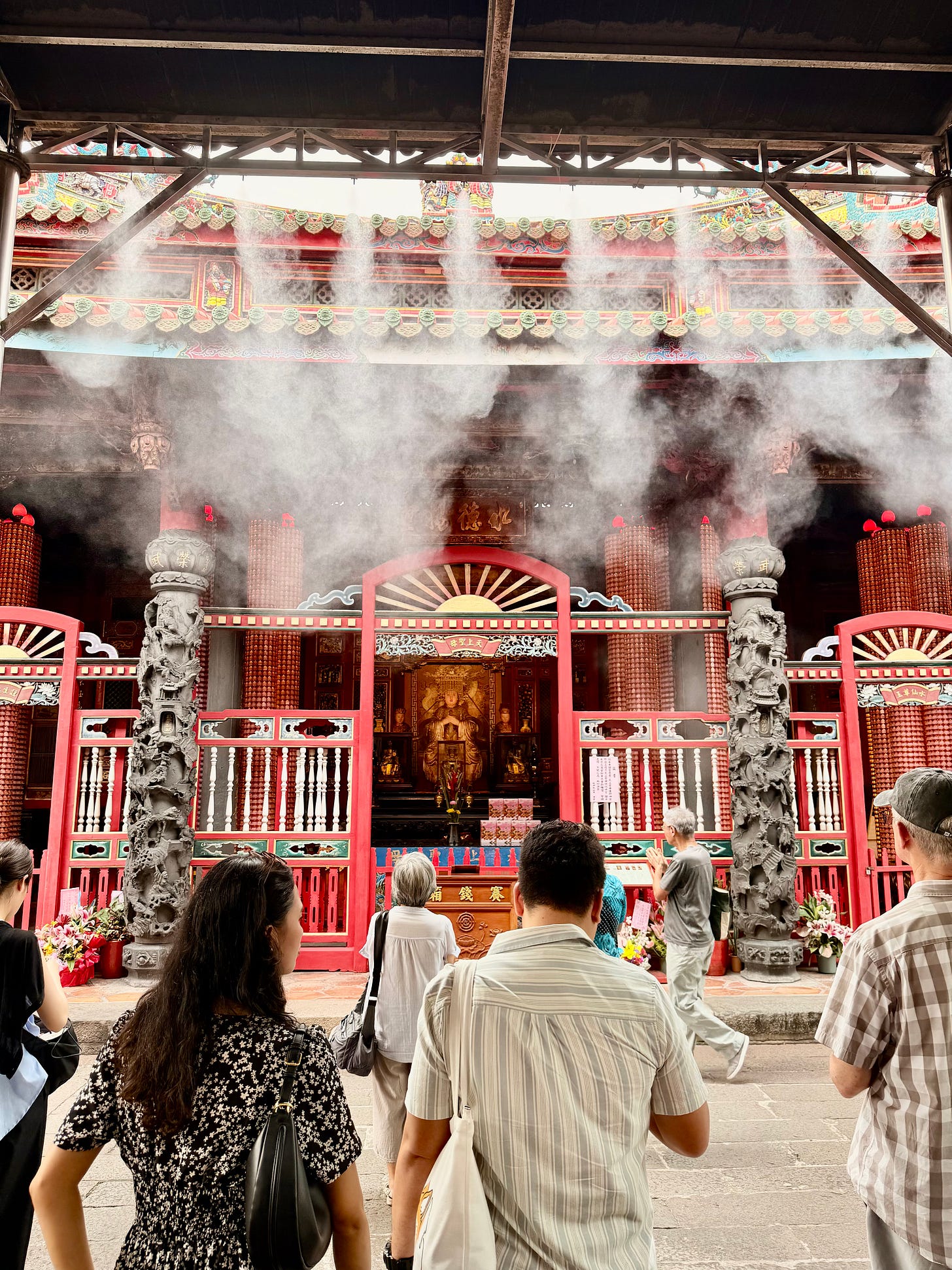 Misters cool off worshippers at Longshan Temple, Taipei