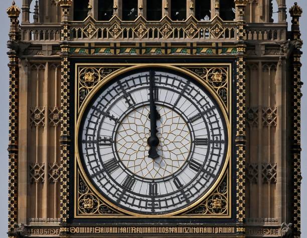 One of the four faces of the Great Clock of the Elizabeth Tower, commonly referred to as Big Ben, is pictured at the Houses of Parliament at midday...