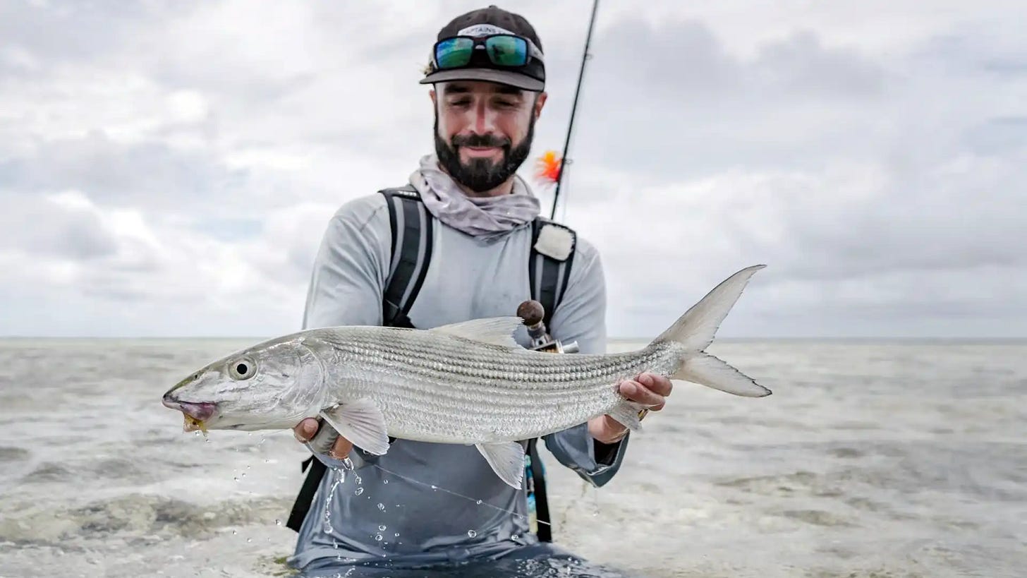 Angler with Large Giant Trevally