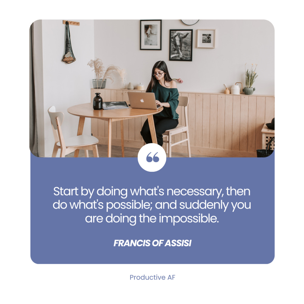 Productive AF inspirational quote graphic featuring a woman working on a laptop at a modern kitchen table, with the quote by Francis of Assisi: 'Start by doing what's necessary, then do what's possible; and suddenly you are doing the impossible.' Productivity and motivation theme.