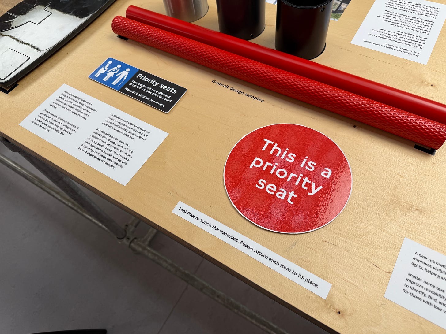Photo showing signage samples and grab poles. Photo showing signage samples and grab poles.
