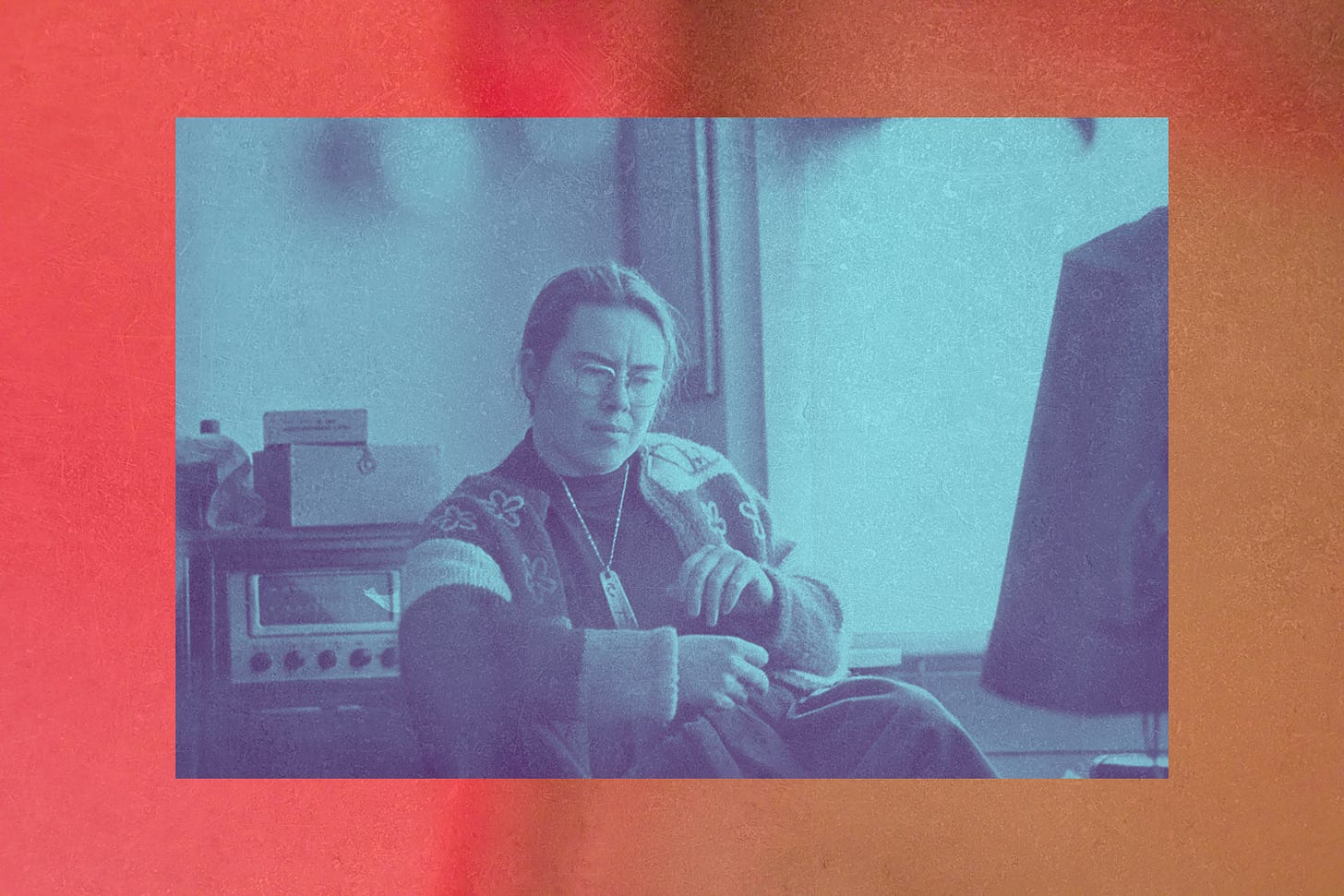 image of composer Pauline Oliveros with her gaze looking downward, listening to something or everything.