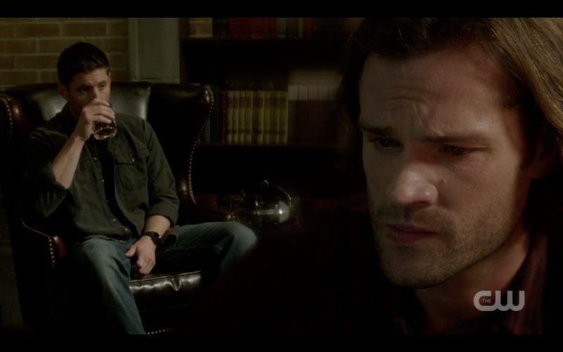 supernatural dean winchester drinking while sam looks concerned 1307