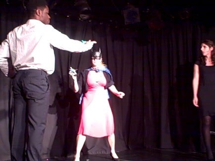 Photo of actors standing in a threatening way