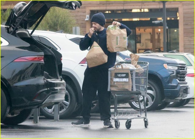 r/Fauxmoi - Please enjoy this series of photos showing Sebastian Stan dropping his groceries