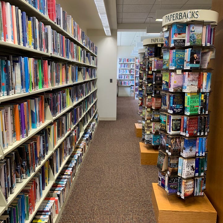 Four photos of libraries, featuring shelves of books and patrons
