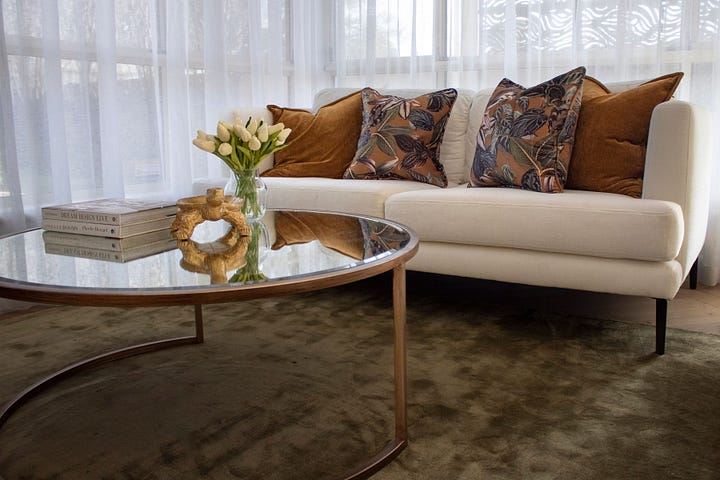 luxury resort-style kitchen in wood grain and super white quartzite designed by Plush Design Interiors and Penelope Herbert