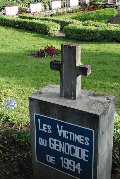 Genocide Memorial Cross Musanze Rwanda Central Africa The Genocide Memorial to those killed in 1994 in Ruhengeri (Musanze) Rwanda, Central Africa.  It is in a shape of a cross and overlooks a garden area. rwanda genocide stock pictures, royalty-free photos & images