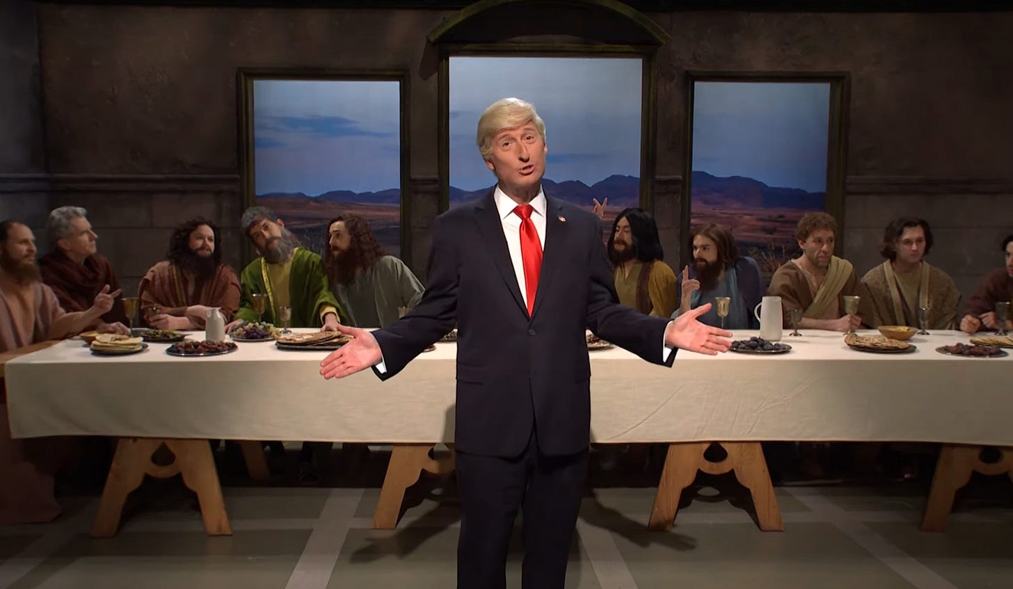 Screenshot of 'Saturday Night Live' sketch with James Austin Johnson as Donald Trump, standing before a tableau vivant of Leonardo's 'Last Supper.' Damn right we said 'tableau vivant' in alt-text Screenshot of 'Saturday Night Live' sketch with James Austin Johnson as Donald Trump, standing before a tableau vivant of Leonardo's 'Last Supper.' Damn right we said 'tableau vivant' in alt-text