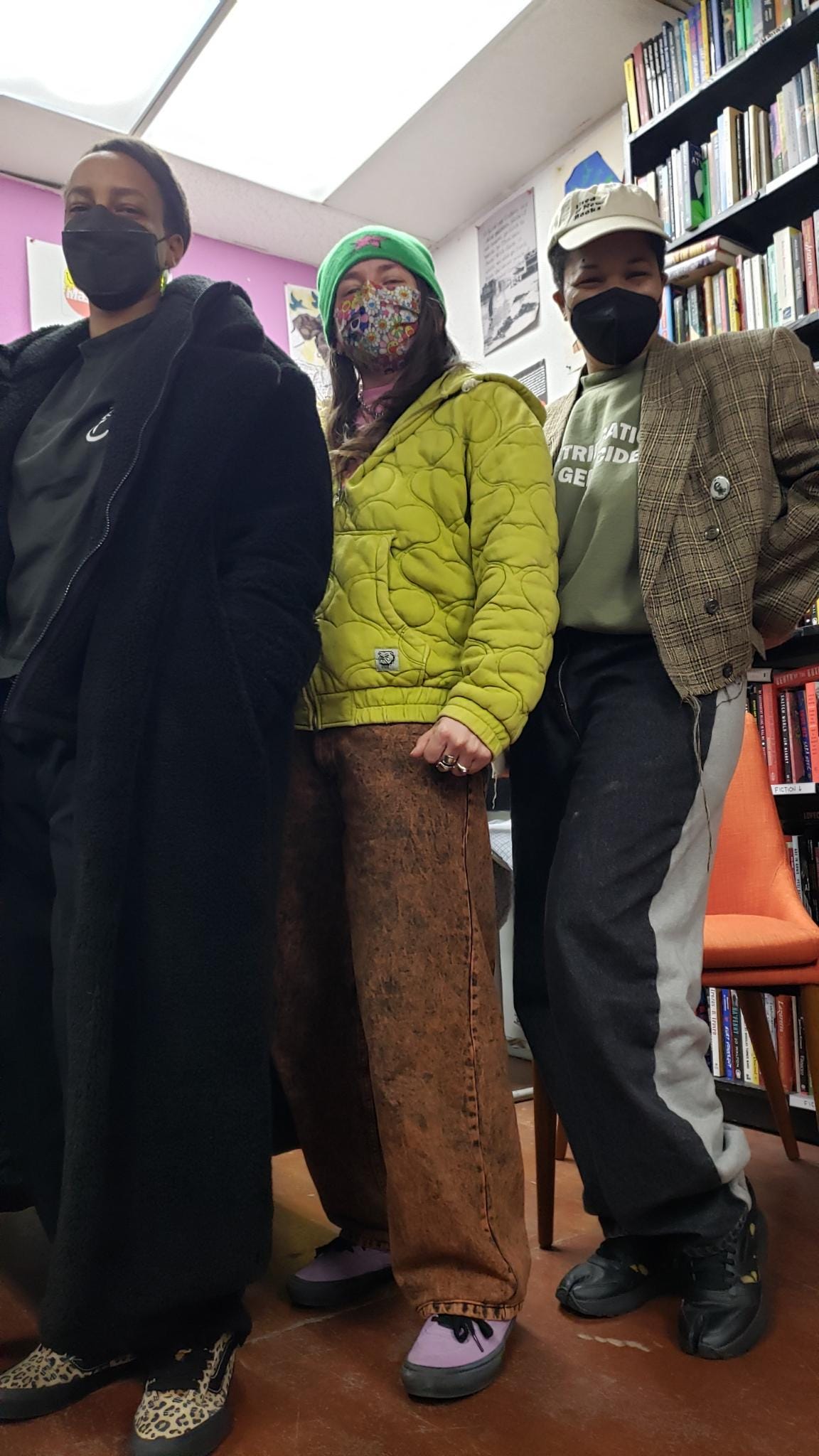 Ras, M, & Rasheedah pose for a picture in a bookstore