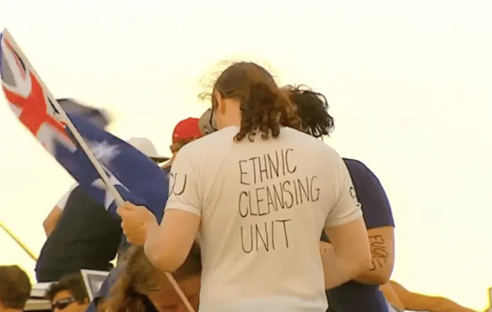 A still from the video shared by Australian neo-Nazis, appearing to show a gathering of white Australians at Cronulla beach and videos of subsequent violence. A still from the video shared by Australian neo-Nazis, appearing to show a gathering of white Australians at Cronulla beach and videos of subsequent violence.