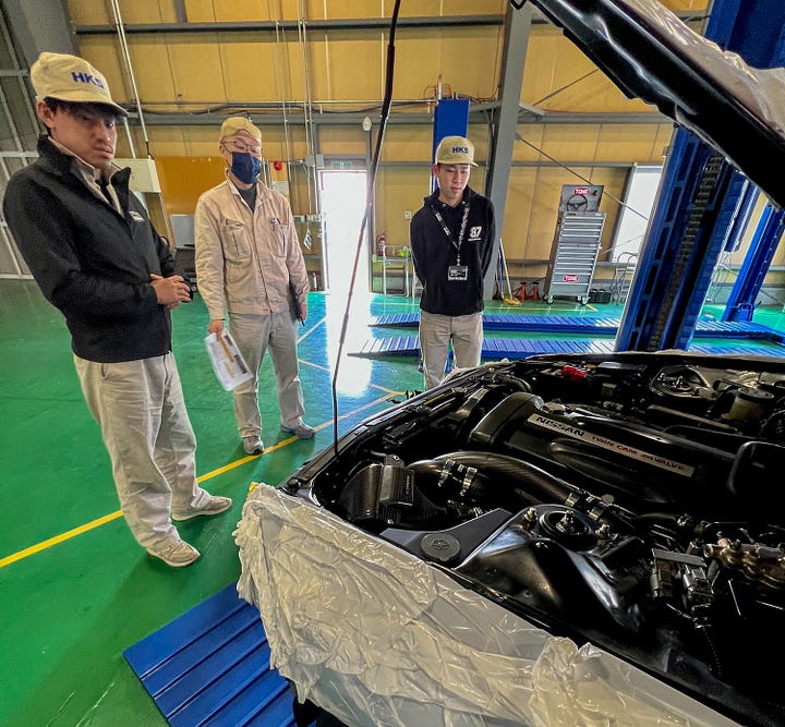 Production-ready carbon fiber HKS parts fitted to an R32 GT-R owned by President Daisuke Mizuguchi at company headquarters.