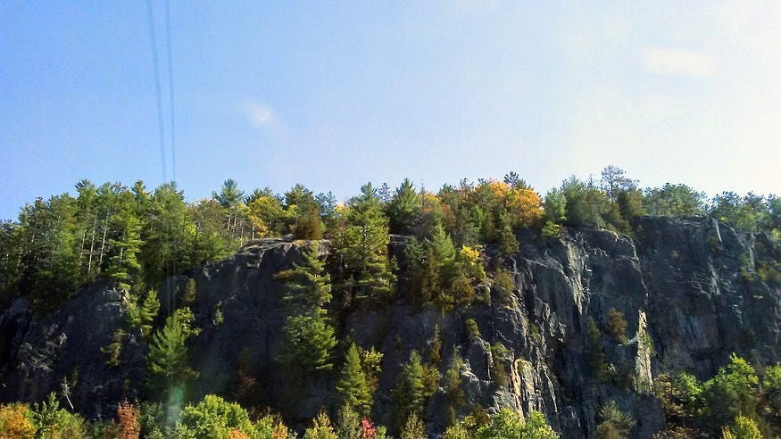 Treed autumnal cliffs near Bancroft, Ontario.