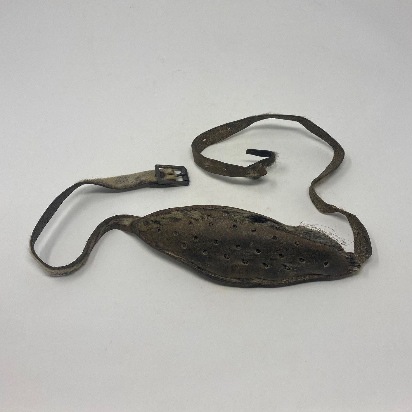 May be an image of belt buckle and text