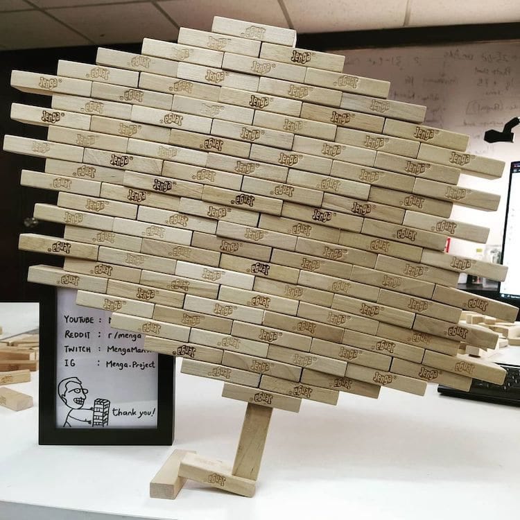 Guy Breaks His Own World Record for Balancing 1,512 Jenga on One