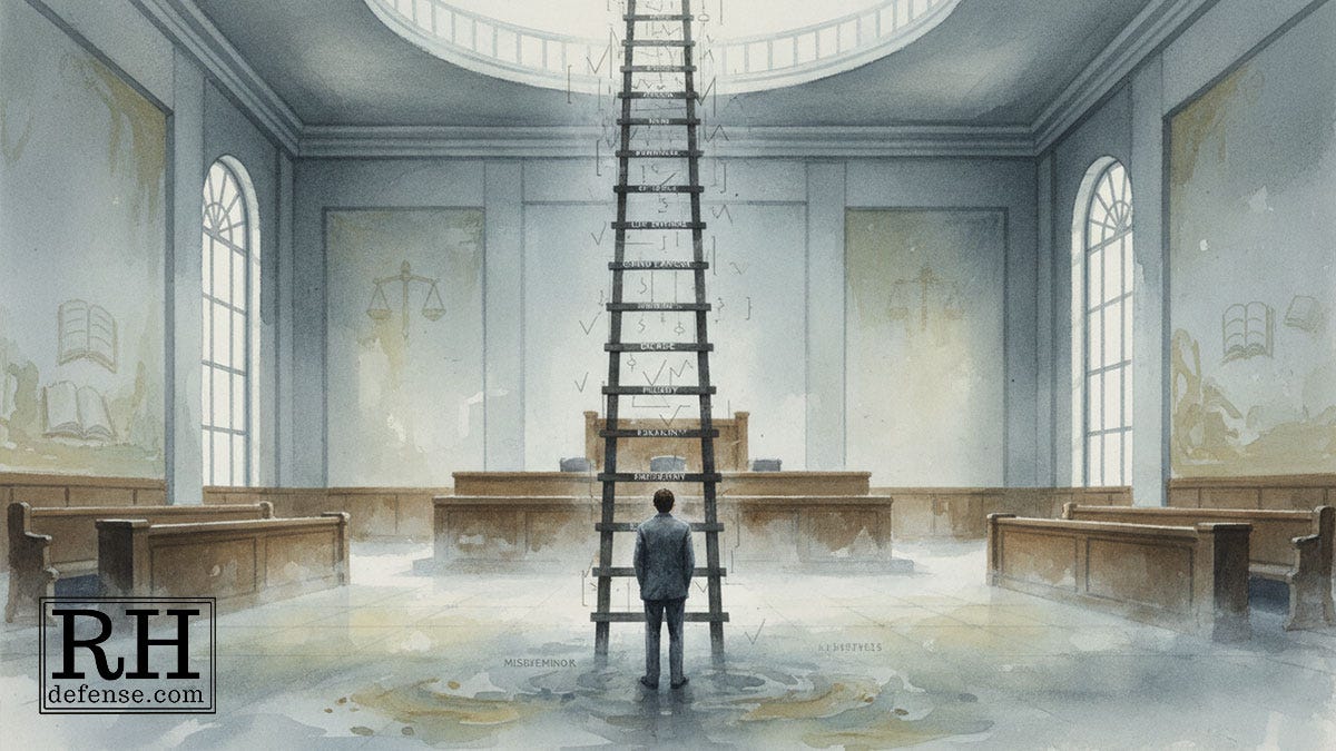 A person stands in an empty courtroom facing a tall ladder rising upward in front of the judge’s bench. A person stands in an empty courtroom facing a tall ladder rising upward in front of the judge’s bench.