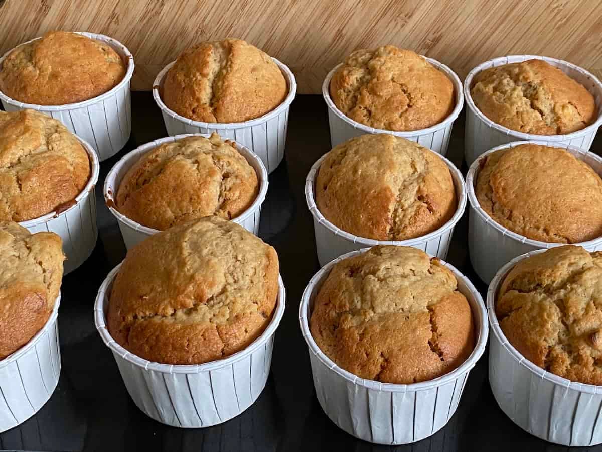 Baked Banana and Peanut Butter Muffins on a baking tray.
