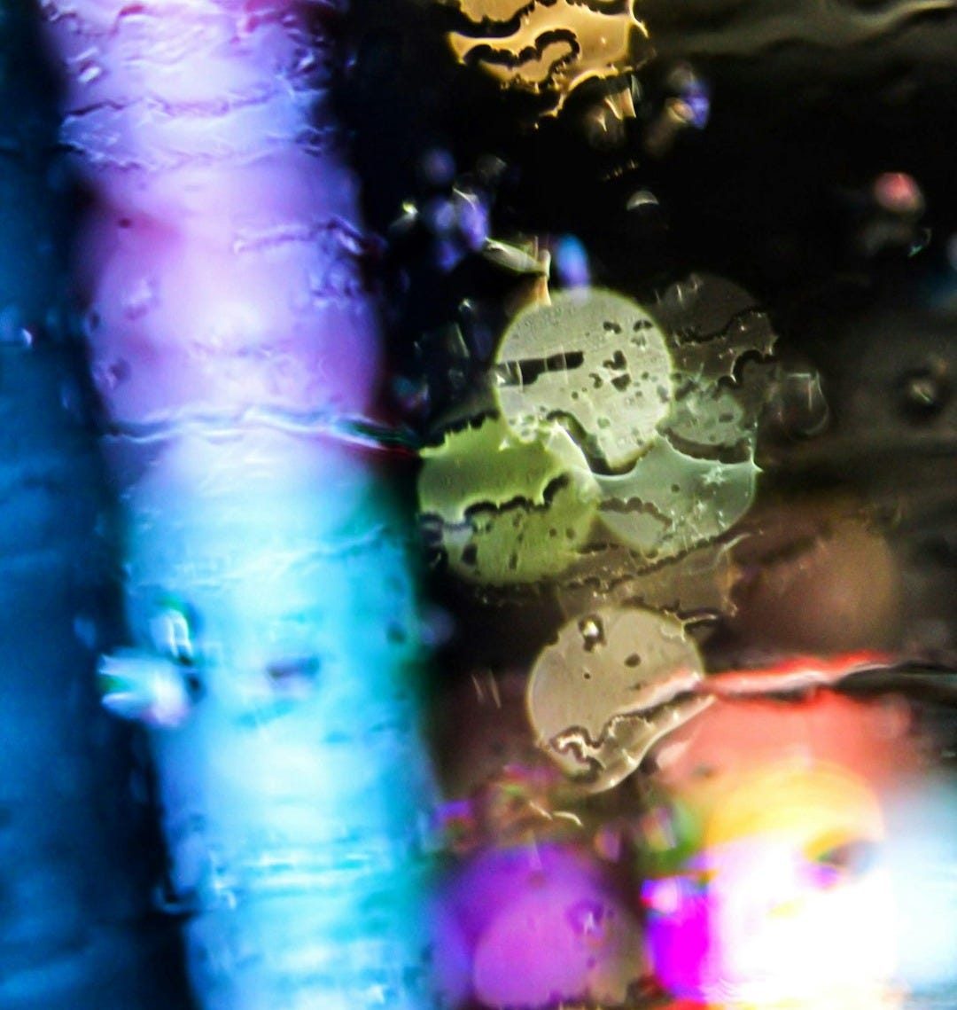 A close up of water droplets on a glass surface A close up of water droplets on a glass surface