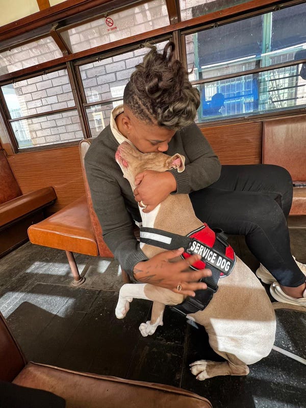 Azure Antoinette and her service dog Bella are reunited after 2 years of bureaucratic red tape