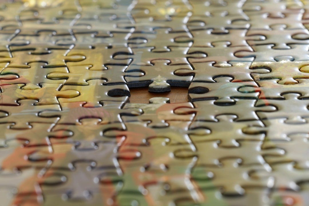 a close up view of a puzzle piece a close up view of a puzzle piece