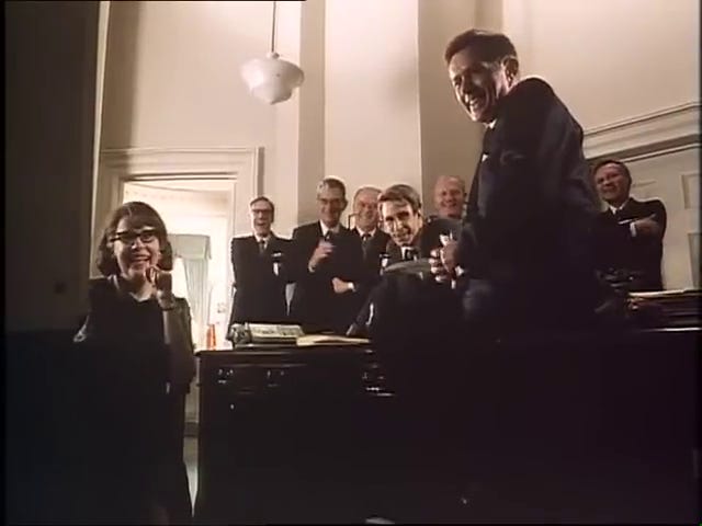 The Freedom 7 launch; Kennedy and his staff watch the launch on television.