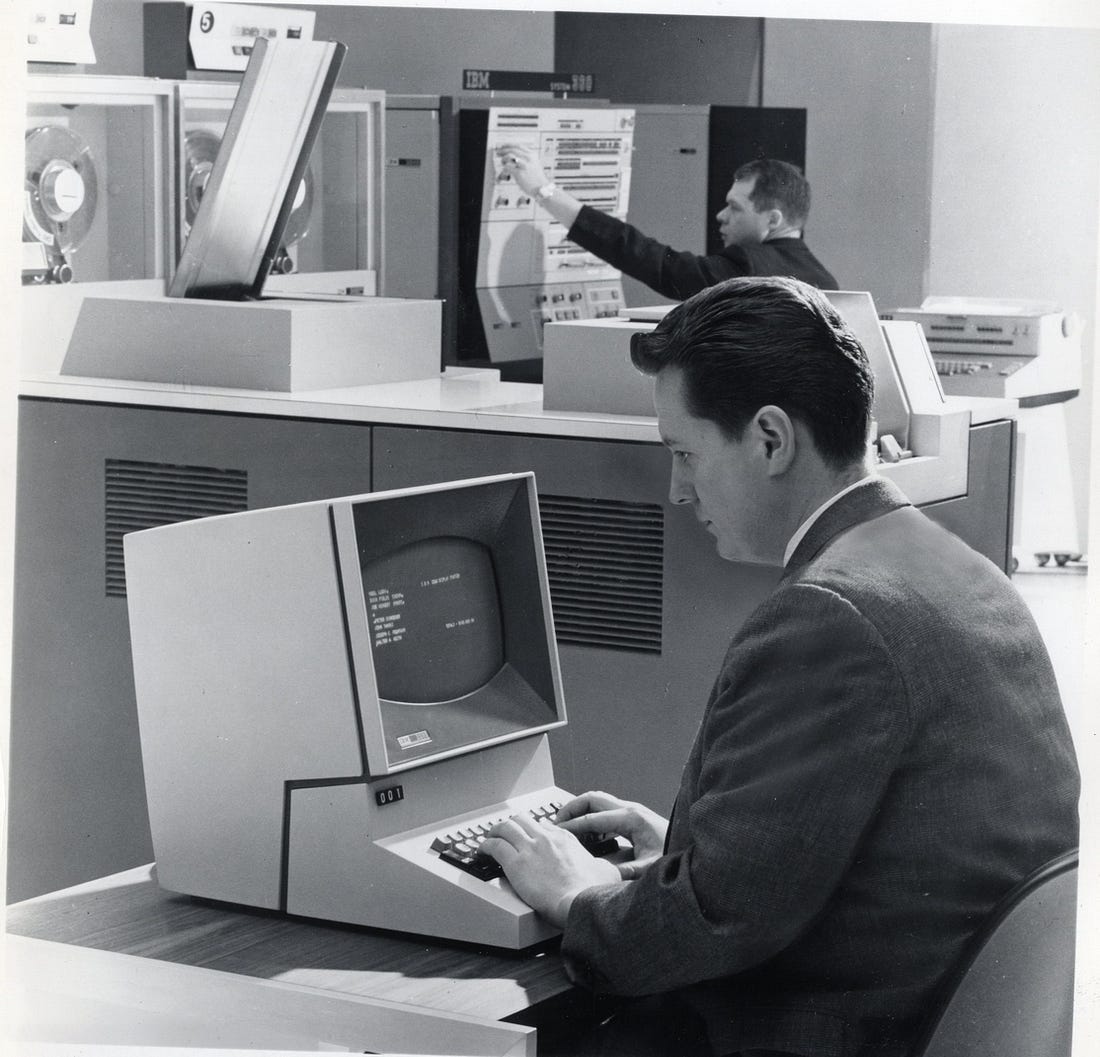 A man working with an IBM 2260