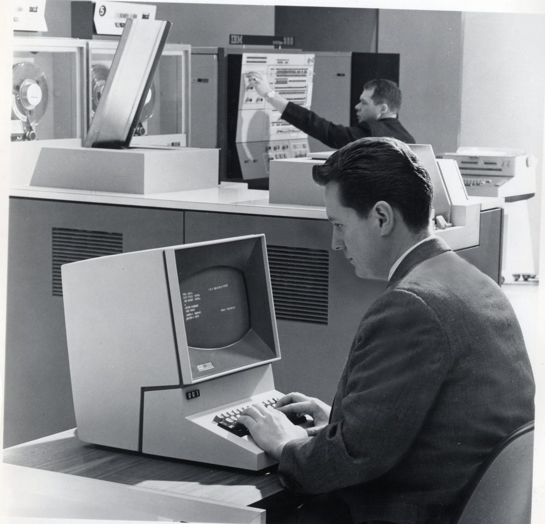 A man working with an IBM 2260